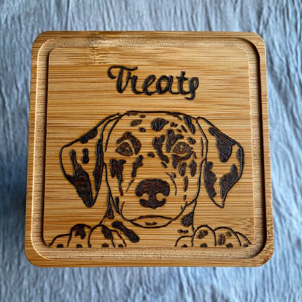 Wood burned bamboo lid with image of a Dalmatian face