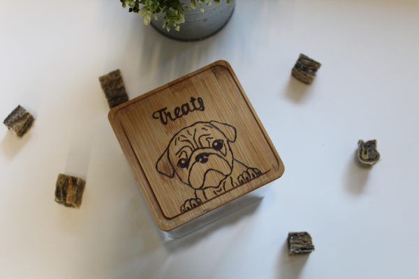 Wooden treat box lid with wood burned image of a pug dog